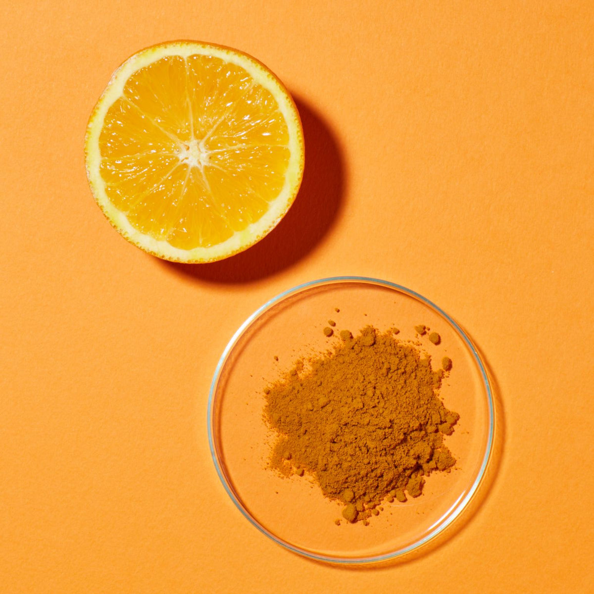 Turmeric Powder and an Orange